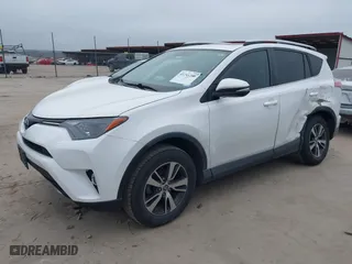 2016 Toyota RAV4 XLE with VIN 2T3WFREV8GW259777, listed as a IAAI auction lot 41241266 with 129,122 mi miles. Bid and sale history available at carsss.com. Image 2.