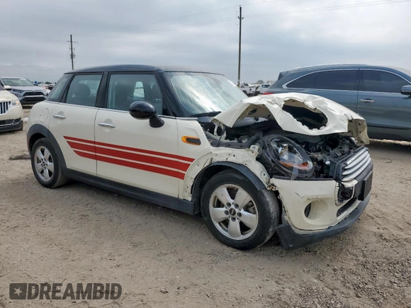 2015 MINI Hardtop 4 Door with VIN WMWXS5C51FT831167, listed as a Copart auction lot 52778685 with 52,770 mi miles and Salvage title. Bid and sale history available at DreamBid. Image 4.