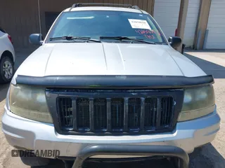 2004 Jeep Grand Cherokee Laredo with VIN 1J4GW48S74C260968, listed as a IAAI auction lot 42050628 with 192,602 mi miles. Bid and sale history available at carsss.com. Image 6.