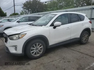 2014 Mazda CX-5 Touring z VIN JM3KE2CY6E0409206, wystawiony jako Copart lot #55696005 z przebiegiem 201 899 mil mil oraz Szkoda całkowita • Salvage title. Historia ofert i sprzedaży dostępna na DreamBid. Obrazek 1.