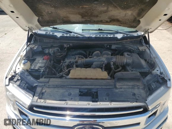 2018 Ford F-150 XL z VIN 1FTEX1EBXJKF62172, wystawiony jako Copart lot #61038035 z przebiegiem 153 069 mil mil oraz Czysty tytuł • Clean title. Historia ofert i sprzedaży dostępna na DreamBid. Obrazek 11.