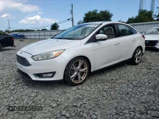 2016 Ford Focus Titanium z VIN 1FADP3J29GL223778, wystawiony jako Copart lot #66171735 z przebiegiem Nie podano mil oraz Szkoda całkowita • Salvage title. Historia ofert i sprzedaży dostępna na DreamBid. Obrazek 1.