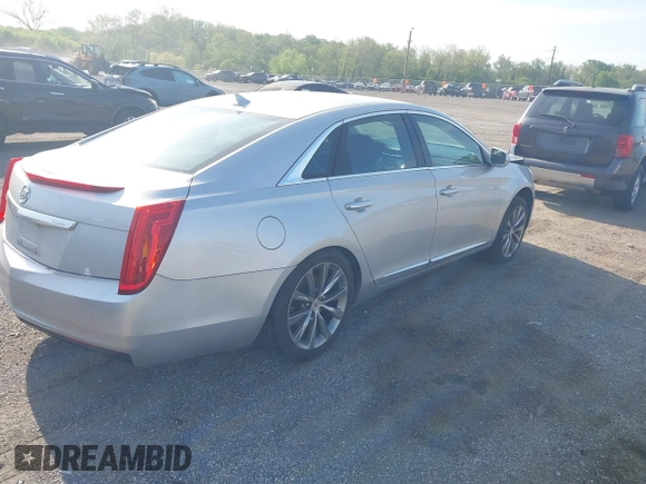 2013 Cadillac XTS with VIN 2G61N5S31D9135710, listed as a IAAI auction lot 42002480 with 162,029 mi miles. Bid and sale history available at carsss.com. Image 4.