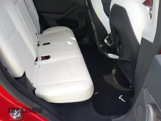 2023 Tesla Model Y Long Range with VIN 7SAYGDEE1PA154996, listed as a IAAI auction lot 41472595 with 24,861 mi miles and . Bid and sale history available at DreamBid. Image 8.