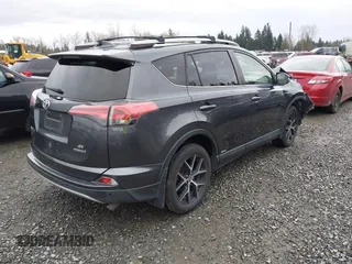 2018 Toyota RAV4 Hybrid SE with VIN JTMJJREV7JD208249, listed as a IAAI auction lot 41859301 with 91,899 mi miles and . Bid and sale history available at DreamBid. Image 4.