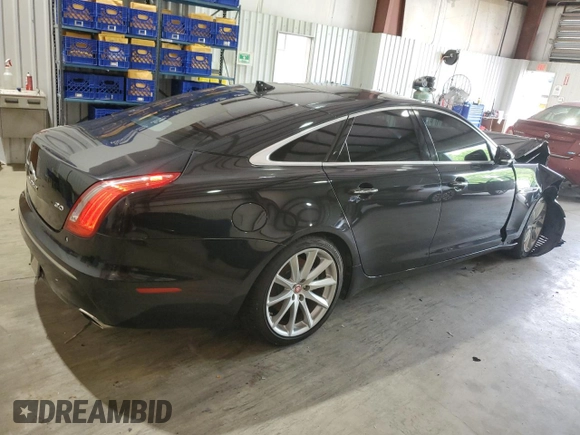 2014 Jaguar XJ with VIN SAJWA1CZ0E8V61168, listed as a Copart auction lot 54383215 with 137,724 mi miles and Salvage Title. Bid and sale history available at DreamBid. Image 3.