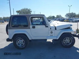 2001 Jeep Wrangler Sahara with VIN 1J4FA59S51P332107, listed as a IAAI auction lot 40954726 with 150,671 mi miles. Bid and sale history available at carsss.com. Image 13.
