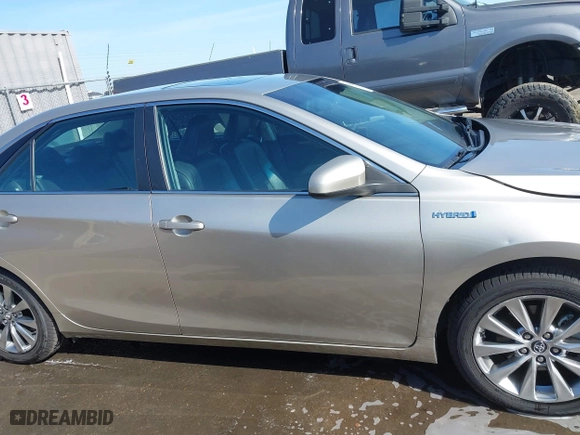 2015 Toyota Camry Hybrid LE with VIN 4T1BD1FK1FU174975, listed as a IAAI auction lot 42085034 with 54,728 mi miles. Bid and sale history available at carsss.com. Image 14.