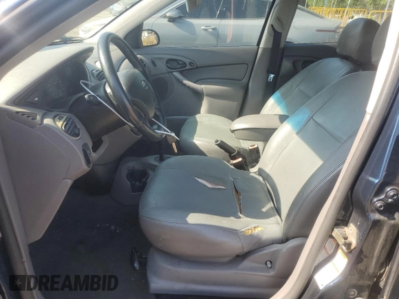 2003 Ford Focus with VIN 1FAHP36Z43W316899, listed as a Copart auction lot 55343955 with 178,646 mi miles and Salvage title. Bid and sale history available at DreamBid. Image 7.