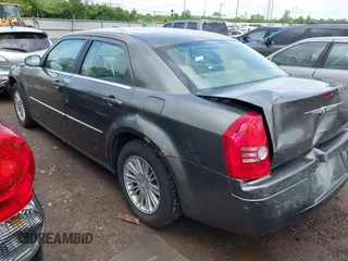 2009 Chrysler 300 LX with VIN 2C3KA43D49H558006, listed as a IAAI auction lot 42178195 with 208,864 mi miles and . Bid and sale history available at carsss.com. Image 3.