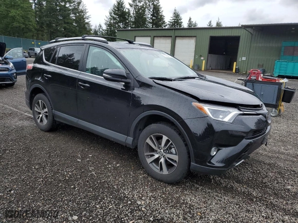 2018 Toyota RAV4 XLE with VIN 2T3RFREV6JW720057, listed as a Copart auction lot 51526465 with 74,687 mi miles and Salvage Title. Bid and sale history available at carsss.com. Image 4.