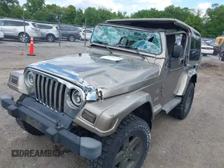 2004 Jeep Wrangler Sahara with VIN 1J4FA59S54P740417, listed as a IAAI auction lot 42382078 with 200,108 mi miles and . Bid and sale history available at DreamBid. Image 6.