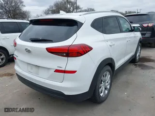 2019 Hyundai Tucson Value with VIN KM8J3CA42KU874050, listed as a IAAI auction lot 41516201 with 146,795 mi miles. Bid and sale history available at carsss.com. Image 4.