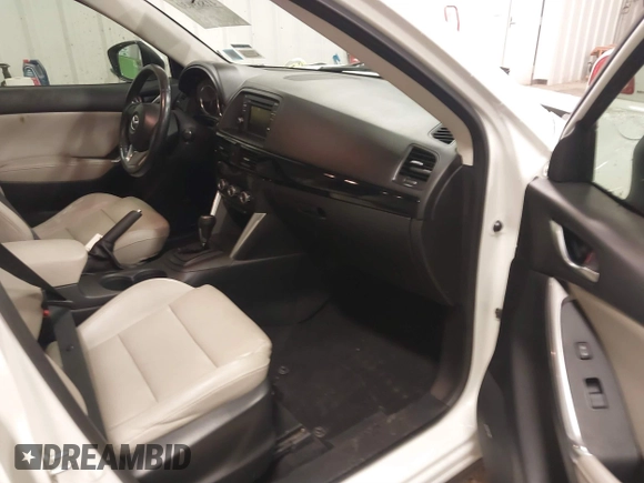 2014 Mazda CX-5 Grand Touring with VIN JM3KE4DY3E0374036, listed as a IAAI auction lot 41889030 with 162,611 mi miles and . Bid and sale history available at DreamBid. Image 5.