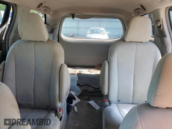 2012 Toyota Sienna with VIN 5TDZK3DC8CS198495, listed as a Copart auction lot 57335205 with 66,786 mi miles and Salvage title. Bid and sale history available at DreamBid. Image 10.