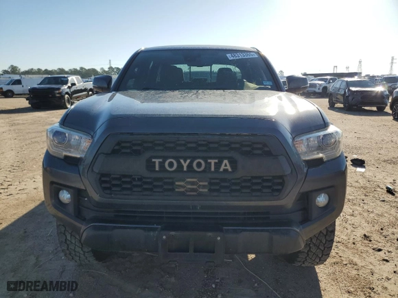 2019 Toyota Tacoma 4WD SR with VIN 3TMCZ5AN7KM287170, listed as a Copart auction lot 48313365 with 75,986 mi miles and Salvage Title. Bid and sale history available at carsss.com. Image 5.