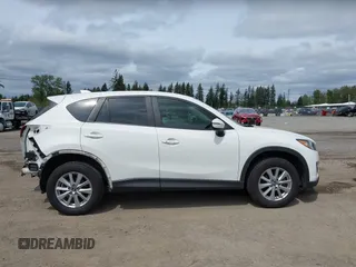 2015 Mazda CX-5 Touring with VIN JM3KE4CY4F0488484, listed as a IAAI auction lot 42115093 with 156,344 mi miles. Bid and sale history available at carsss.com. Image 14.