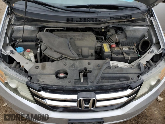2014 Honda Odyssey LX z VIN 5FNRL5H21EB106600, wystawiony jako Copart lot #57875765 z przebiegiem 122 159 mil mil oraz Szkoda całkowita • Salvage title. Historia ofert i sprzedaży dostępna na DreamBid. Obrazek 12.