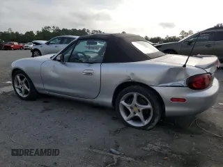 2003 Mazda MX-5 Miata Cloth z VIN JM1NB353630305964, wystawiony jako Copart lot #58517505 z przebiegiem 129 675 mil mil oraz Szkoda całkowita • Salvage title. Historia ofert i sprzedaży dostępna na DreamBid. Obrazek 2.