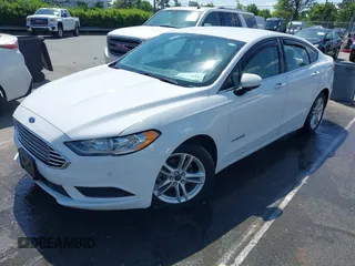 2018 Ford Fusion S z VIN 3FA6P0UU1JR204607, wystawiony jako IAAI lot #41985269 z przebiegiem 116 517 mil mil oraz . Historia ofert i sprzedaży dostępna na DreamBid. Obrazek 2.