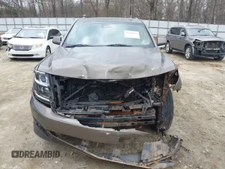 2015 Chevrolet Suburban LT z VIN 1GNSCJKC6FR675585, wystawiony jako IAAI lot #41510570 z przebiegiem 156 818 mil mil oraz . Historia ofert i sprzedaży dostępna na DreamBid. Obrazek 11.