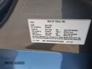 2023 Tesla Model Y Long Range with VIN 7SAYGAEE8PF976969, listed as a IAAI auction lot 41877784 with 25,896 mi miles. Bid and sale history available at carsss.com. Image 9.