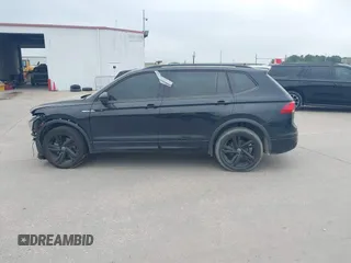 2023 Volkswagen Tiguan SE R-Line Black with VIN 3VVCB7AX1PM106543, listed as a IAAI auction lot 41784559 with 39,846 mi miles and . Bid and sale history available at DreamBid. Image 15.