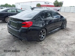 2016 Subaru WRX with VIN JF1VA1B65G9801044, listed as a IAAI auction lot 41973939 with 82,420 mi miles. Bid and sale history available at carsss.com. Image 4.