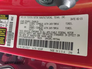 2021 Toyota Tacoma SR z VIN 5TFCZ5AN2MX263159, wystawiony jako IAAI lot #42273087 z przebiegiem 69 220 mil mil oraz . Historia ofert i sprzedaży dostępna na DreamBid. Obrazek 9.