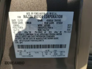 2006 Mazda Tribute S with VIN 4F2YZ04116KM23873, listed as a Copart auction lot 79926084 with 67,142 mi miles and Salvage Title. Bid and sale history available at DreamBid. Image 13.