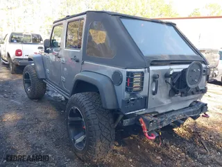2015 Jeep Wrangler Unlimited Rubicon Hard Rock with VIN 1C4HJWFG1FL777222, listed as a IAAI auction lot 41843893 with 74,718 mi miles. Bid and sale history available at carsss.com. Image 3.