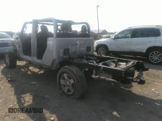 2022 Jeep Gladiator Willys with VIN 1C6HJTAG0NL131004, listed as a IAAI auction lot 40307060 with Not provided miles and . Bid and sale history available at DreamBid. Image 3.