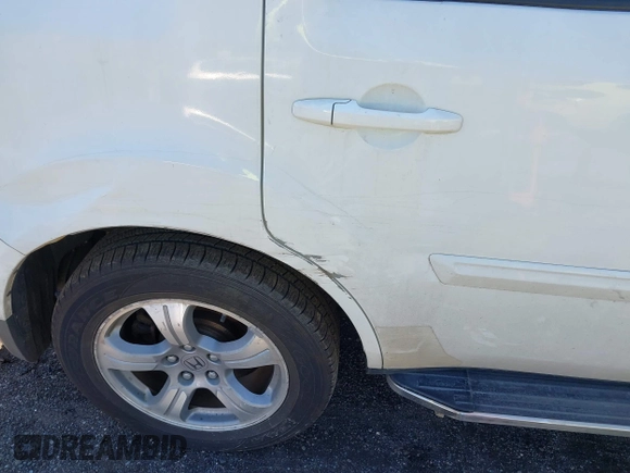 2012 Honda Pilot EX-L with VIN 5FNYF4H54CB041911, listed as a IAAI auction lot 41968540 with 124,646 mi miles and . Bid and sale history available at DreamBid. Image 17.