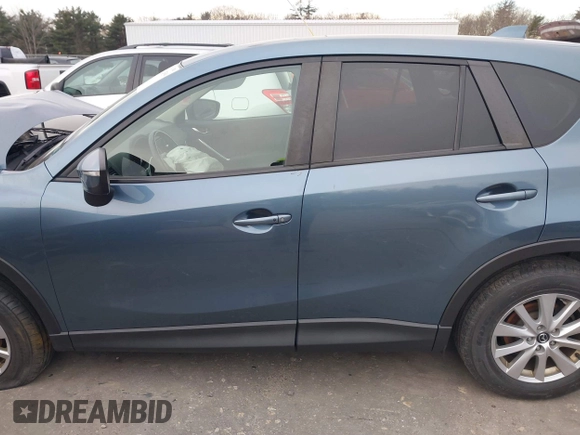 2015 Mazda CX-5 Touring with VIN JM3KE4CY1F0545305, listed as a IAAI auction lot 41234599 with 92,791 mi miles. Bid and sale history available at carsss.com. Image 14.