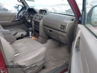 1998 Mitsubishi Montero z VIN JA4MR51RXWJ003468, wystawiony jako IAAI lot #41916695 z przebiegiem 214 694 mil mil oraz . Historia ofert i sprzedaży dostępna na DreamBid. Obrazek 5.