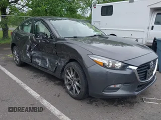 2018 Mazda 3 Touring z VIN 3MZBN1V31JM268280, wystawiony jako IAAI lot #42276418 z przebiegiem 58 366 mil mil oraz . Historia ofert i sprzedaży dostępna na DreamBid. Obrazek 6.