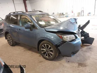 2018 Subaru Forester Premium with VIN JF2SJGECXJH606668, listed as a IAAI auction lot 41879710 with 64,910 mi miles. Bid and sale history available at carsss.com. Image 1.