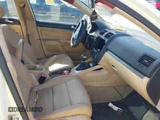 2007 Volkswagen Jetta Wolfsburg Edition z VIN 3VWEF71K77M077224, wystawiony jako IAAI lot #41762803 z przebiegiem Nie podano mil oraz . Historia ofert i sprzedaży dostępna na DreamBid. Obrazek 5.