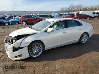 2013 Cadillac XTS Platinum z VIN 2G61V5S34D9199062, wystawiony jako Copart lot #50045295 z przebiegiem 70 854 mil mil oraz Szkody całkowita. Historia ofert i sprzedaży dostępna na DreamBid. Obrazek 1.