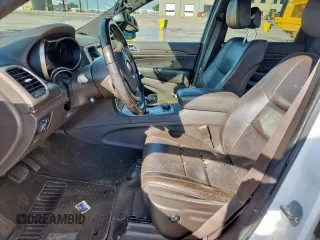 2014 Jeep Grand Cherokee Summit with VIN 1C4RJFJG9EC338666, listed as a Copart auction lot 63834075 with 196,840 mi miles and Salvage title. Bid and sale history available at DreamBid. Image 7.
