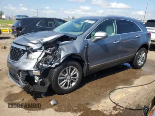 2022 Cadillac XT5 AWD Premium Luxury with VIN 1GYKNDR44NZ130545, listed as a Copart auction lot 57099435 with 13,810 mi miles and Salvage title. Bid and sale history available at DreamBid. Image 1.