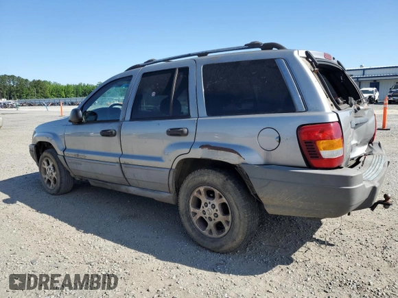 2000 Jeep Grand Cherokee Laredo with VIN 1J4G248S7YC321298, listed as a Copart auction lot 58036255 with 292,779 mi miles and Salvage title. Bid and sale history available at DreamBid. Image 2.