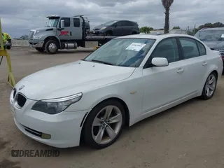 2009 BMW 5 Series 528i with VIN WBANU53529C121927, listed as a IAAI auction lot 42063066 with 195,322 mi miles and . Bid and sale history available at carsss.com. Image 2.