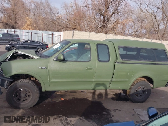 1997 Ford F-150 XL with VIN 1FTDX1861VKA60604, listed as a IAAI auction lot 41060909 with 269,715 mi miles. Bid and sale history available at carsss.com. Image 14.