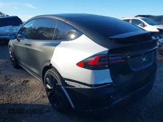 2020 Tesla Model X Long Range with VIN 5YJXCDE28LF298553, listed as a IAAI auction lot 40863184 with 54,031 mi miles and . Bid and sale history available at DreamBid. Image 3.