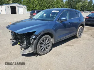 2018 Mazda CX-5 Touring z VIN JM3KFBCM2J1363310, wystawiony jako Copart lot #58969135 z przebiegiem 86 831 mil mil oraz Szkoda całkowita • Salvage title. Historia ofert i sprzedaży dostępna na DreamBid. Obrazek 1.