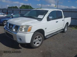 2004 Nissan Titan LE with VIN 1N6AA07A04N561241, listed as a IAAI auction lot 42180597 with 166,529 mi miles and . Bid and sale history available at DreamBid. Image 2.