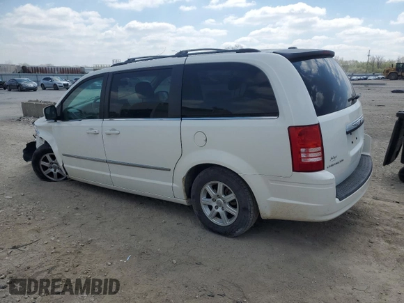 2010 Chrysler Town & Country Touring with VIN 2A4RR5D14AR260321, listed as a Copart auction lot 52700615 with 214,498 mi miles and Salvage Title. Bid and sale history available at DreamBid. Image 2.