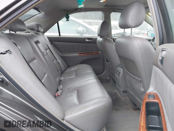 2004 Toyota Camry LE with VIN JTDBF32K740152841, listed as a IAAI auction lot 41808909 with 142,611 mi miles. Bid and sale history available at carsss.com. Image 8.