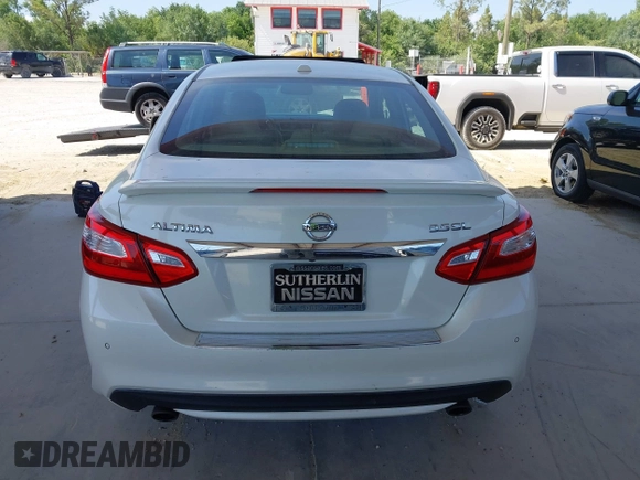 2016 Nissan Altima SL z VIN 1N4BL3AP0GC164425, wystawiony jako IAAI lot #42175694 z przebiegiem 106 255 mil mil oraz . Historia ofert i sprzedaży dostępna na DreamBid. Obrazek 16.
